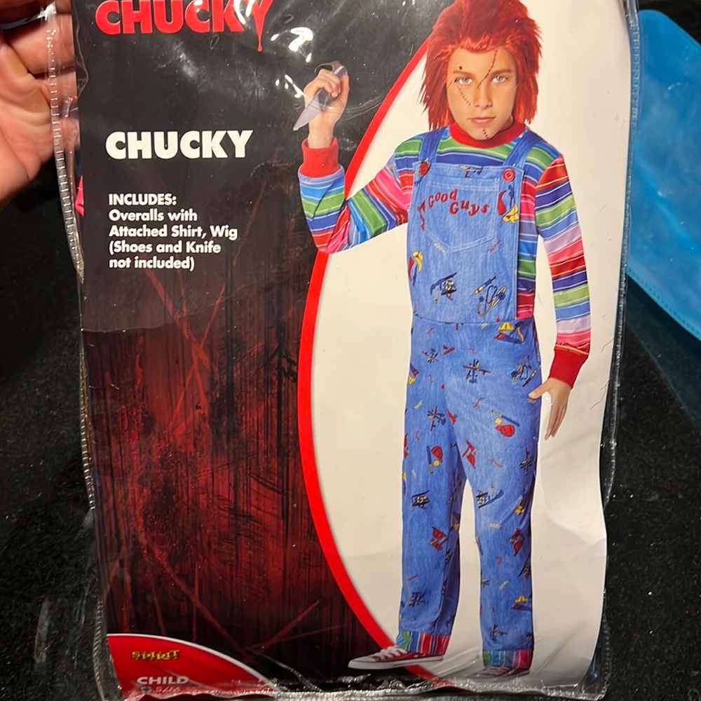 Child size small Chucky costume. Overalls with attached shirt, wig included.